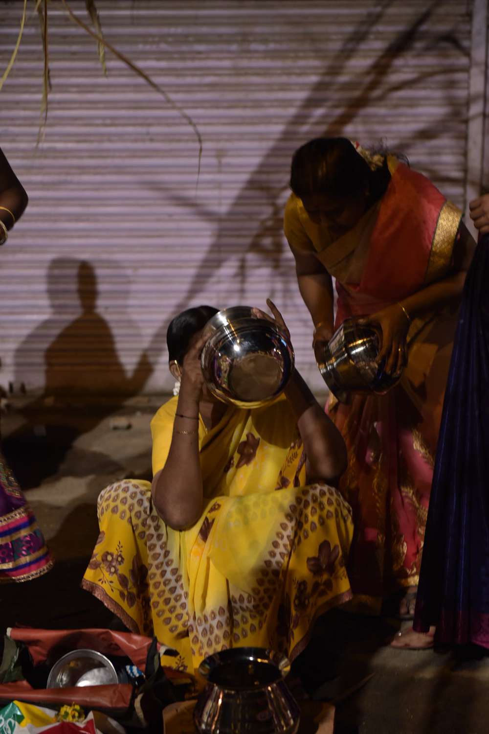 A woman checks a utensil for possible leakages. A woman checks a utensil for possible leakages.