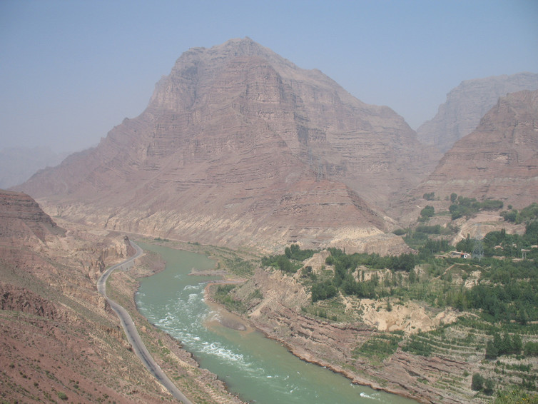 A view of Jishi Gorge, upstream from the landslide dam researchers say unleashed a great flood in China almost 4,000 years ago. Gray silt deposits are visible dozens of meters above the water. Wu Qinglong, CC BY-NC A view of Jishi Gorge, upstream from the landslide dam researchers say unleashed a great flood in China almost 4,000 years ago. Gray silt deposits are visible dozens of meters above the water. Wu Qinglong, CC BY-NC