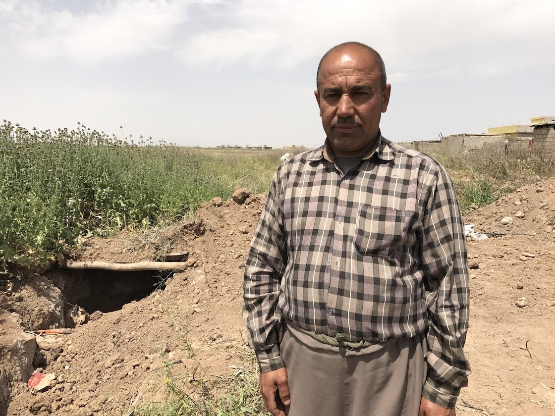 After he came back to his village, Kanaan closed the tunnel dug by ISIS, as seen behind him. After he came back to his village, Kanaan closed the tunnel dug by ISIS, as seen behind him.
