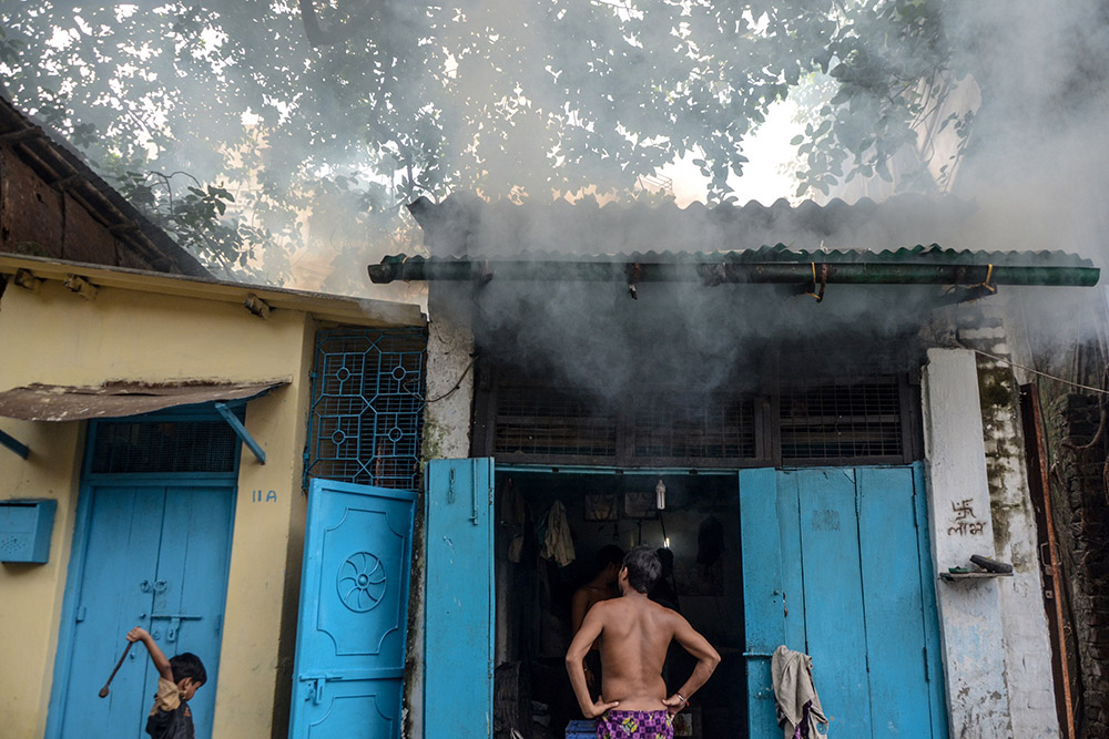 A man looks at the smoke coming out from his shop in North Kolkata. Photo credit: Ronny Sen/Kolkata A man looks at the smoke coming out from his shop in North Kolkata. Photo credit: Ronny Sen/Kolkata