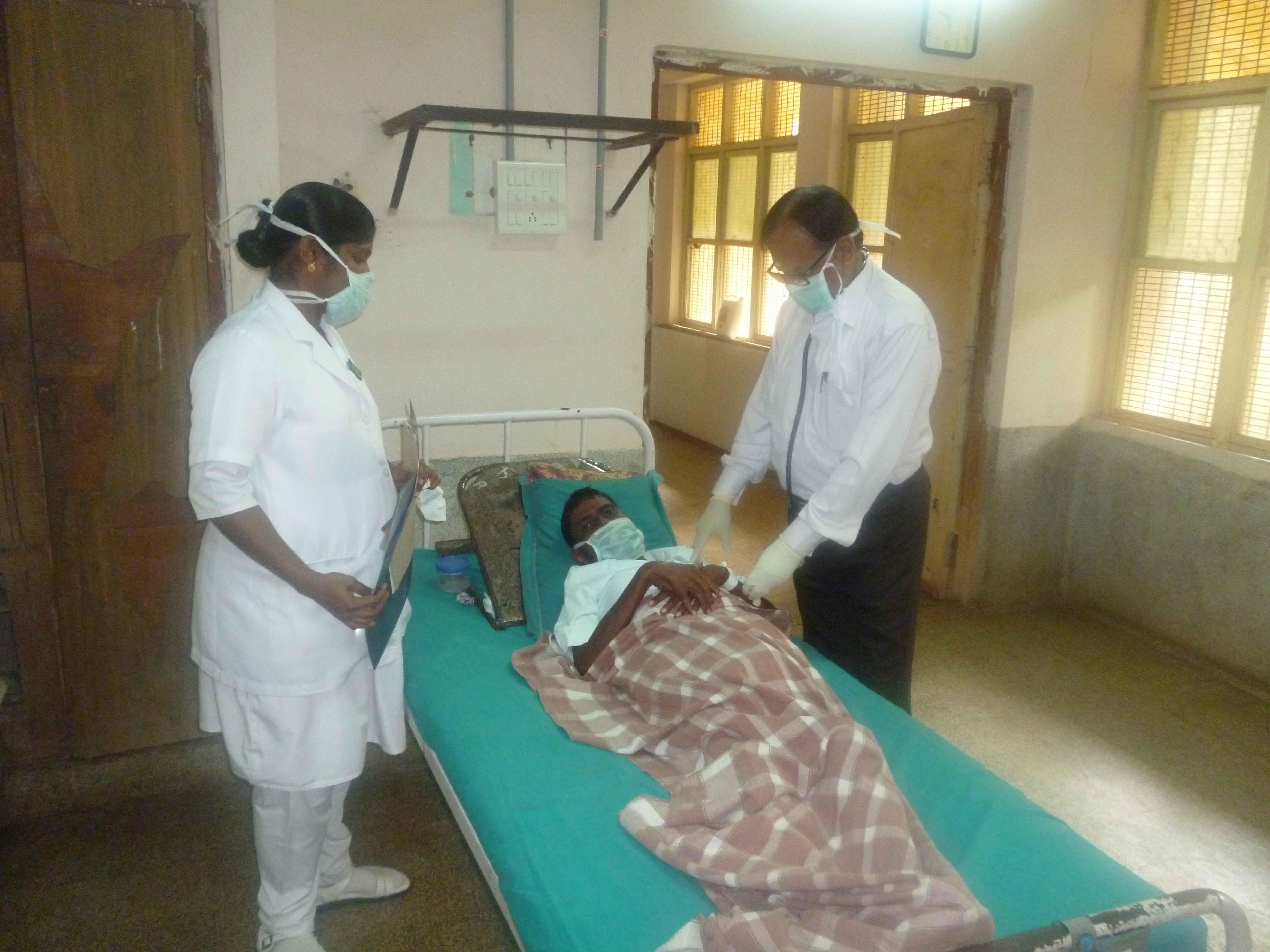 Chest physician Dr Prabhu and staff nurse Mala examine and evaluate a patient who defaulted on his anti-tuberculosis treatment (ATT) and is now a MDR (multi-drug resistant) TB (tuberculosis) suspect at the government hospital for chest diseases in Pondicherry, India, 2014. (Photo: CDC Global/Flickr) Chest physician Dr Prabhu and staff nurse Mala examine and evaluate a patient who defaulted on his anti-tuberculosis treatment (ATT) and is now a MDR (multi-drug resistant) TB (tuberculosis) suspect at the government hospital for chest diseases in Pondicherry, India, 2014. (Photo: CDC Global/Flickr)