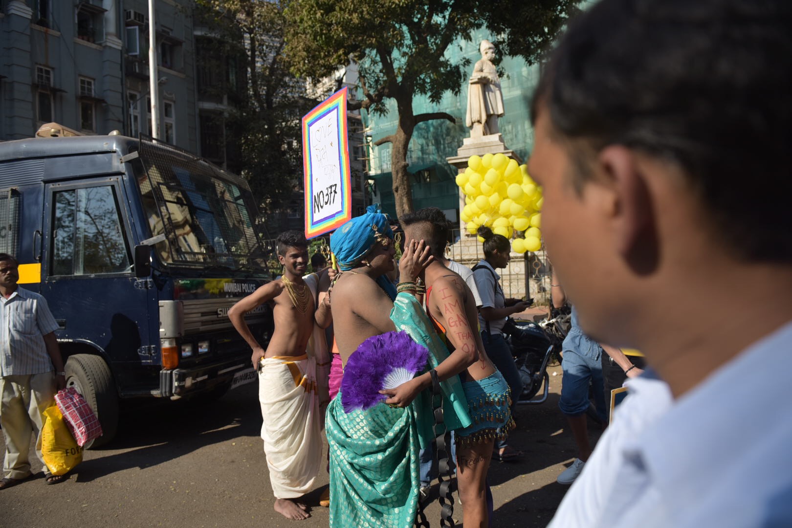 Participants at the Mumbai Gay Pride Parade greet each other enthusiastically. Participants at the Mumbai Gay Pride Parade greet each other enthusiastically.