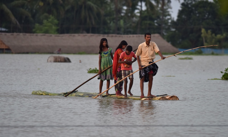 A 2016 photograph of villagers travelling on a raft in flood-affected Sildubi village in Morigoan district, 70 km from Guwahati. (Photo credit: Biju Boro/AFP). A 2016 photograph of villagers travelling on a raft in flood-affected Sildubi village in Morigoan district, 70 km from Guwahati. (Photo credit: Biju Boro/AFP).