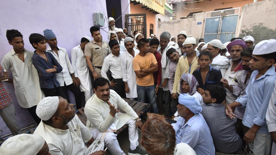 Neighbours gather outside Junaid's home in Khandawli in Faridabad on Friday. Photo credit: Ravi Choudhary/HT Photo Neighbours gather outside Junaid's home in Khandawli in Faridabad on Friday. Photo credit: Ravi Choudhary/HT Photo
