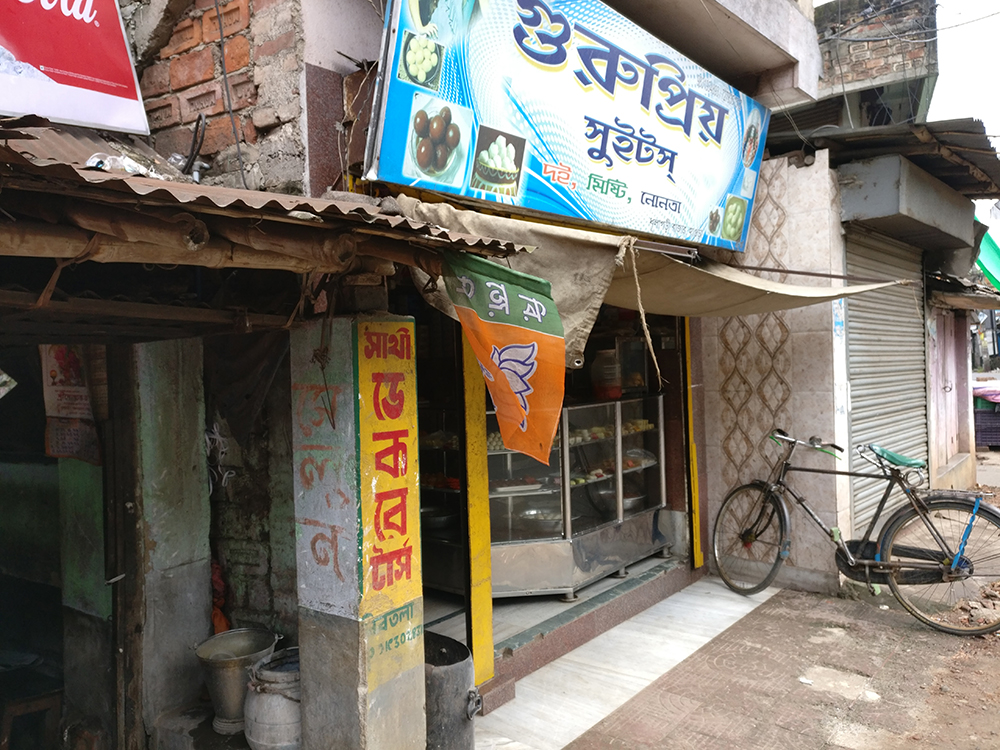 A BJP flag outside a sweet shop in Dhulagarh market. Photo credit: Shoaib Daniyal A BJP flag outside a sweet shop in Dhulagarh market. Photo credit: Shoaib Daniyal
