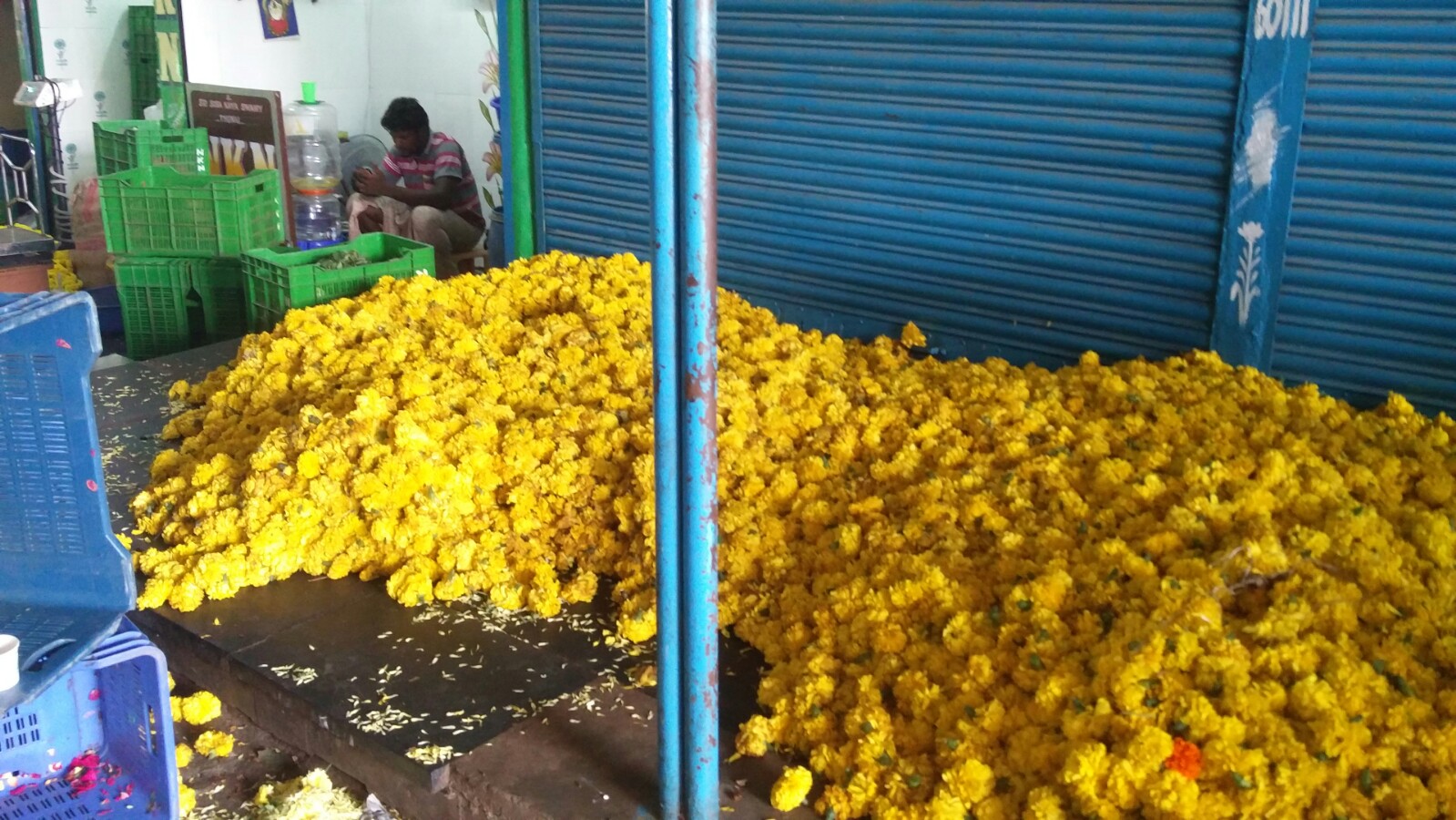 Heaps of unsold flowers at the Koyambedu market. Credit: Vinita Govindarajan Heaps of unsold flowers at the Koyambedu market. Credit: Vinita Govindarajan