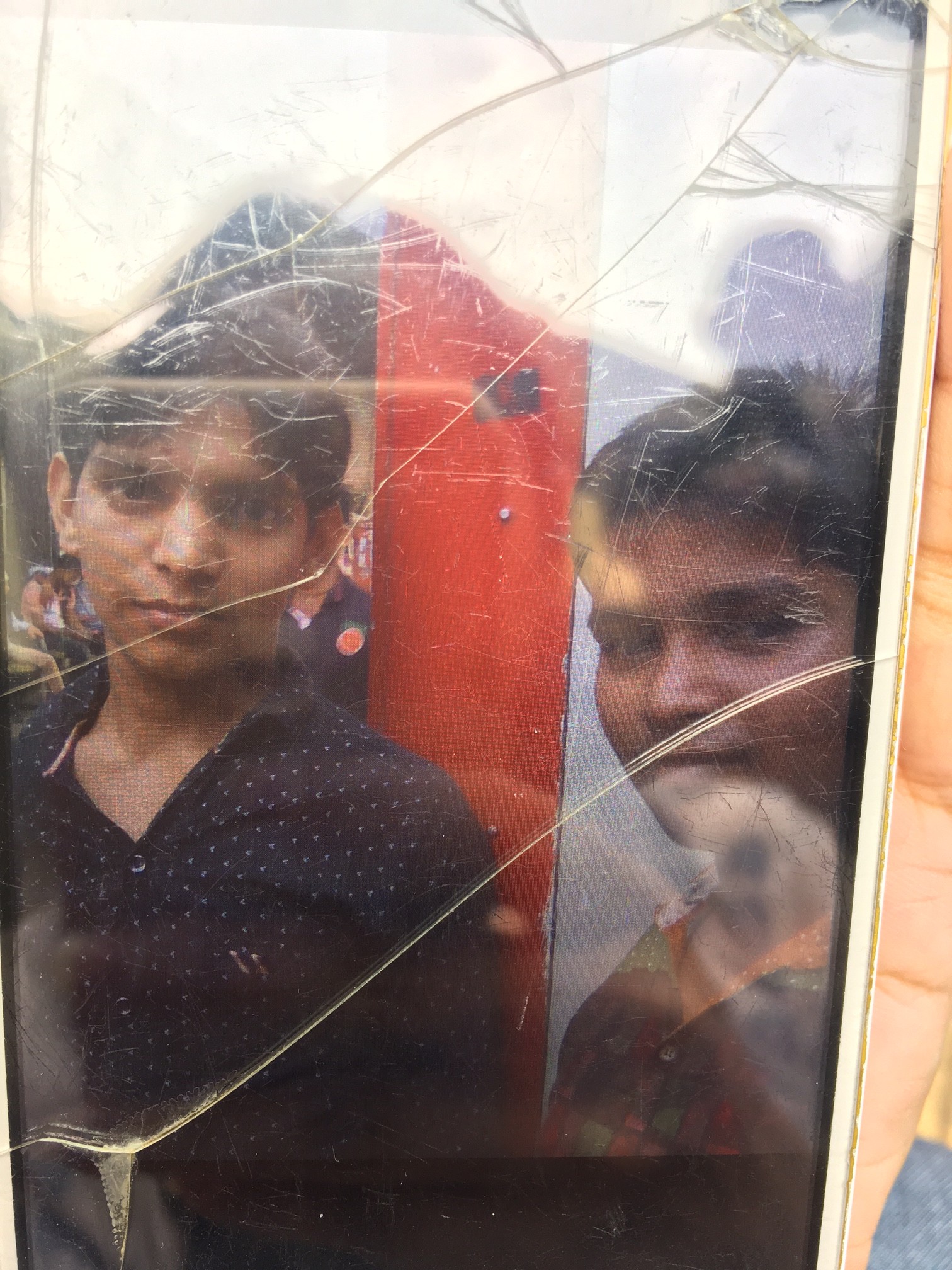 A photograph of deceased factory worker Ram Naresh Gupta (left) with his brother Dilip Gupta, on Dilip Gupta’s mobile phone. A photograph of deceased factory worker Ram Naresh Gupta (left) with his brother Dilip Gupta, on Dilip Gupta’s mobile phone.