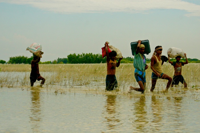 Running to higher ground. Credit: Eklavya Prasad of Megh Pyne Abhiyan, a charitable trust that works on flood-related issues in Bihar. Running to higher ground. Credit: Eklavya Prasad of Megh Pyne Abhiyan, a charitable trust that works on flood-related issues in Bihar.
