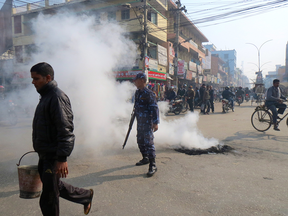 Protesters regularly burn tyres at cross roads across the town. Photo: Anumeha Yadav Protesters regularly burn tyres at cross roads across the town. Photo: Anumeha Yadav