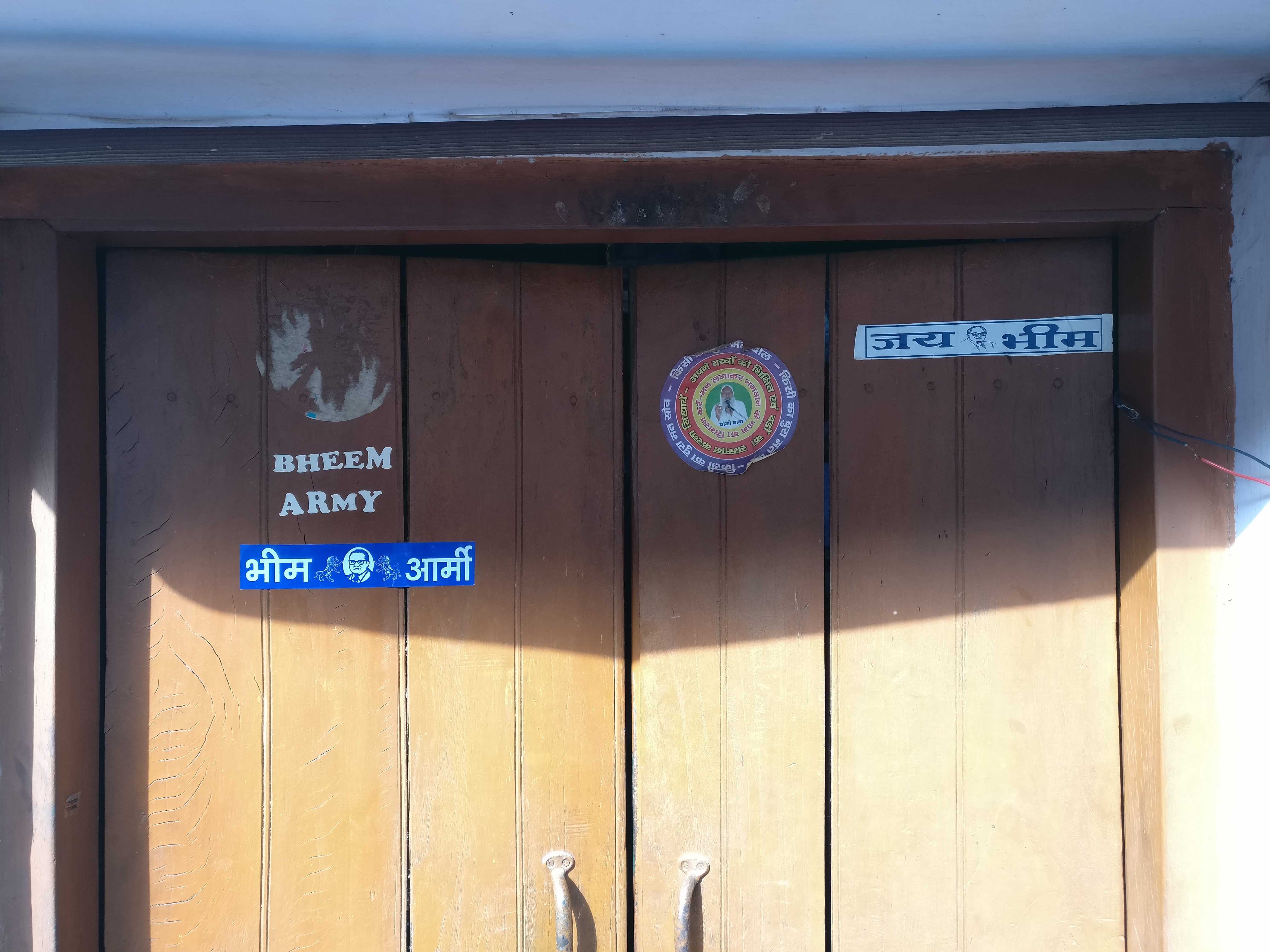 "Bhim Army" and "Jai Bhim" stickers in Chandrashekhar's house. "Bhim Army" and "Jai Bhim" stickers in Chandrashekhar's house.