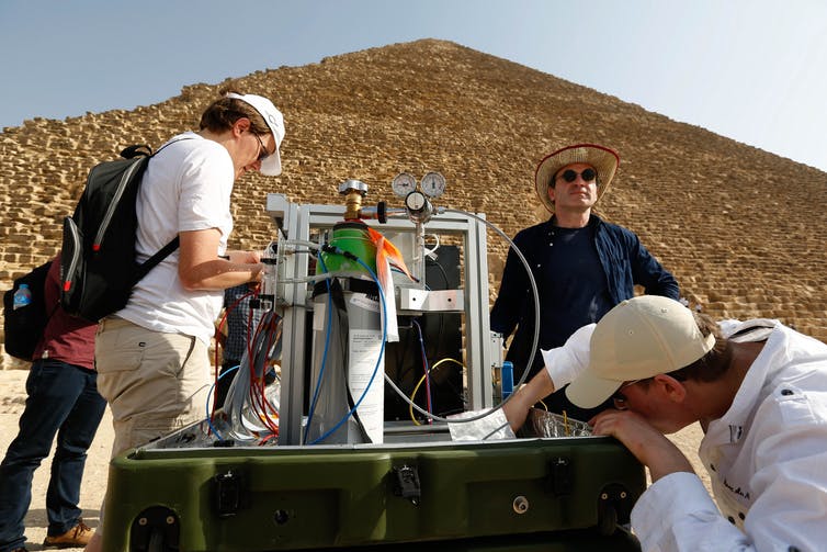 Muon telescope setup in front of Khufus Pyramid. Photo credit: contact@hip.institute Muon telescope setup in front of Khufus Pyramid. Photo credit: contact@hip.institute