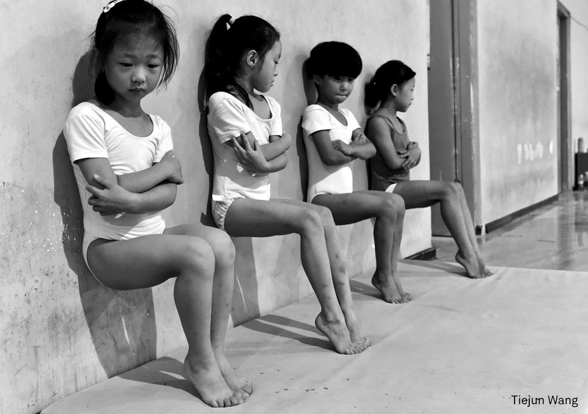 Daily Life, second prize (singles) | Sweat Makes Champions: Four students of a gymnastics school in Xuzhou, China, do toe-pressure training for 30 minutes in the afternoon. (Tiejun Wang, China) Daily Life, second prize (singles) | Sweat Makes Champions: Four students of a gymnastics school in Xuzhou, China, do toe-pressure training for 30 minutes in the afternoon. (Tiejun Wang, China)