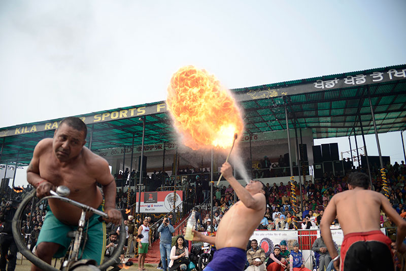 Locals display their fire-blowing skills. Locals display their fire-blowing skills.