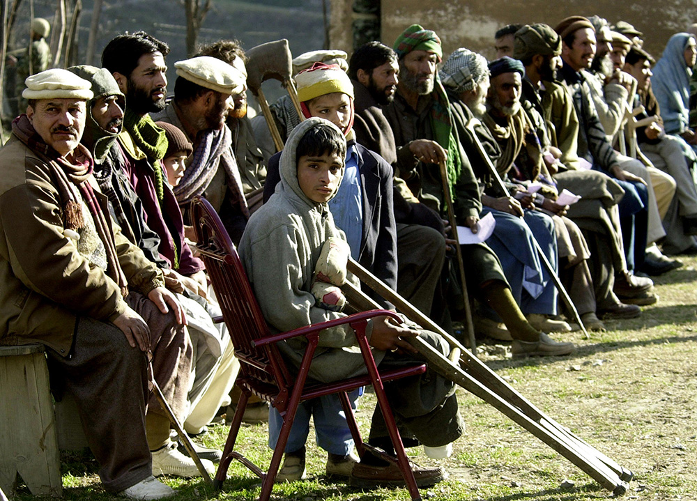 Sixteen-year-old Pakistani Muhammad Ashraf Khan waits in line to be treated at a military hospital in Pakistan-controlled Kashmir in the Neelum Valley, January 2003. Credit: Farooq Naeem/AFP Sixteen-year-old Pakistani Muhammad Ashraf Khan waits in line to be treated at a military hospital in Pakistan-controlled Kashmir in the Neelum Valley, January 2003. Credit: Farooq Naeem/AFP