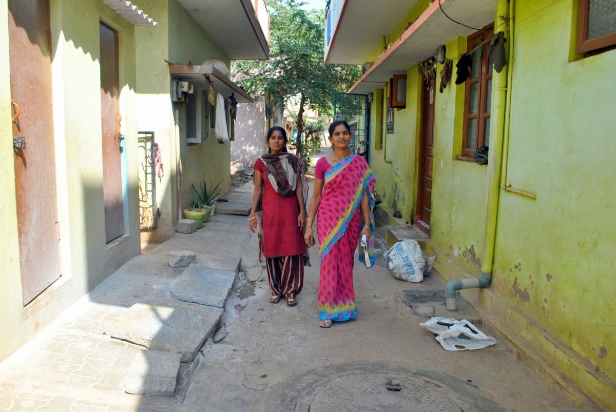 Workers Jayalakshmi and Uma walk through a neighbourhood near Peenya in Bengaluru. Most houses here are rented by garment workers. (Photo credit: Rohini Mohan) Workers Jayalakshmi and Uma walk through a neighbourhood near Peenya in Bengaluru. Most houses here are rented by garment workers. (Photo credit: Rohini Mohan)