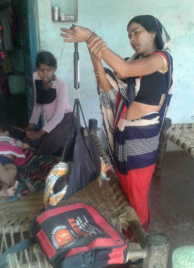 Anita Devi, the ASHA in Garkatua village of Agra district weighting a newborn. Photo credit: Ishita Mishra Anita Devi, the ASHA in Garkatua village of Agra district weighting a newborn. Photo credit: Ishita Mishra