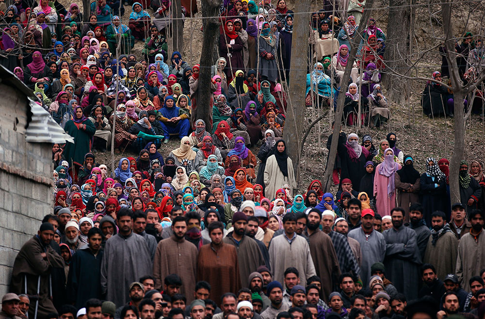 Mourners in Pulwama at the funeral of Raqib Bashir in February. Mourners in Pulwama at the funeral of Raqib Bashir in February.