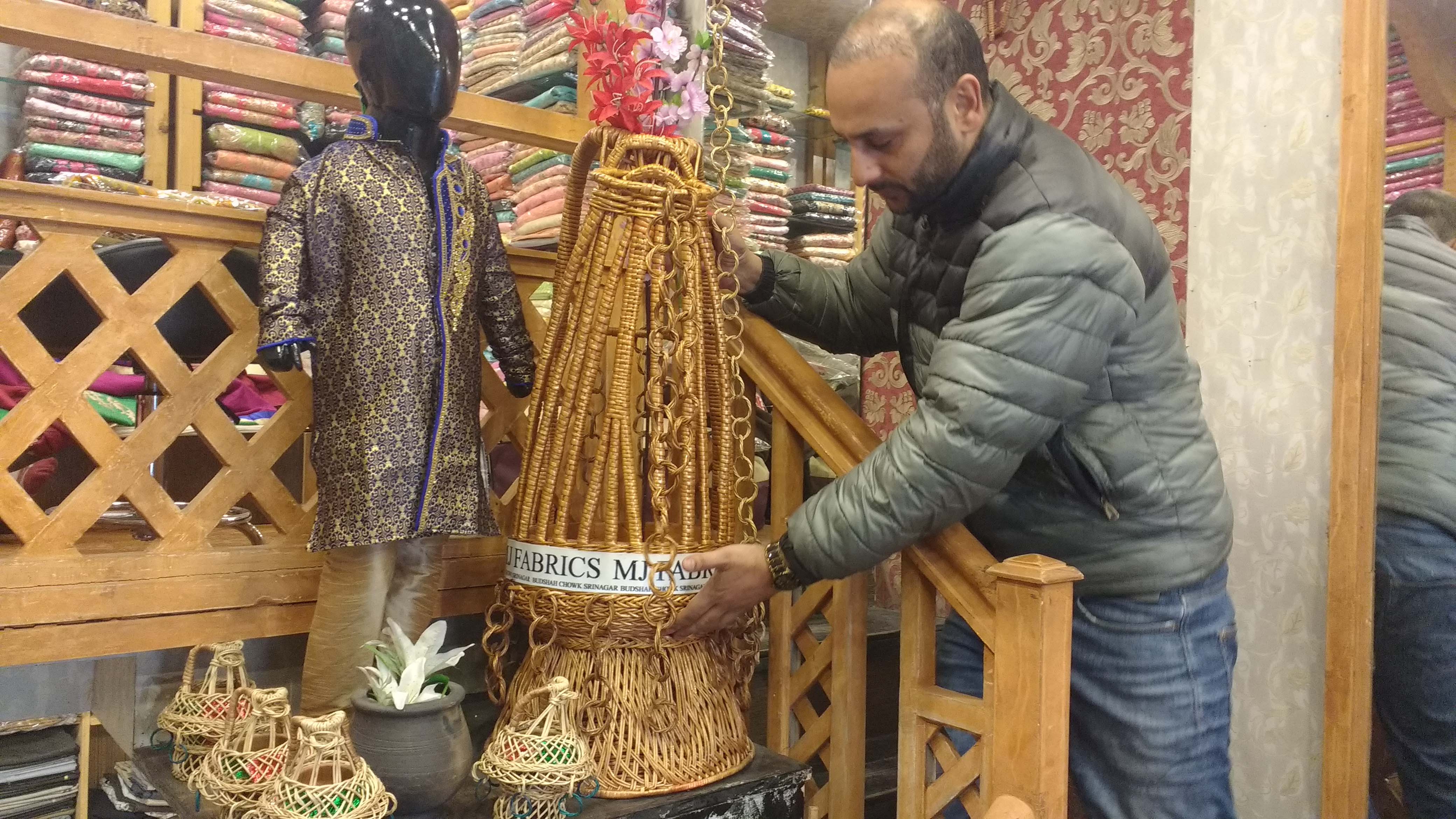 Junaid Handoo displays an oversized kanger in his fabric shop in Lal Chowk area. Photo: Rayan Naqash Junaid Handoo displays an oversized kanger in his fabric shop in Lal Chowk area. Photo: Rayan Naqash