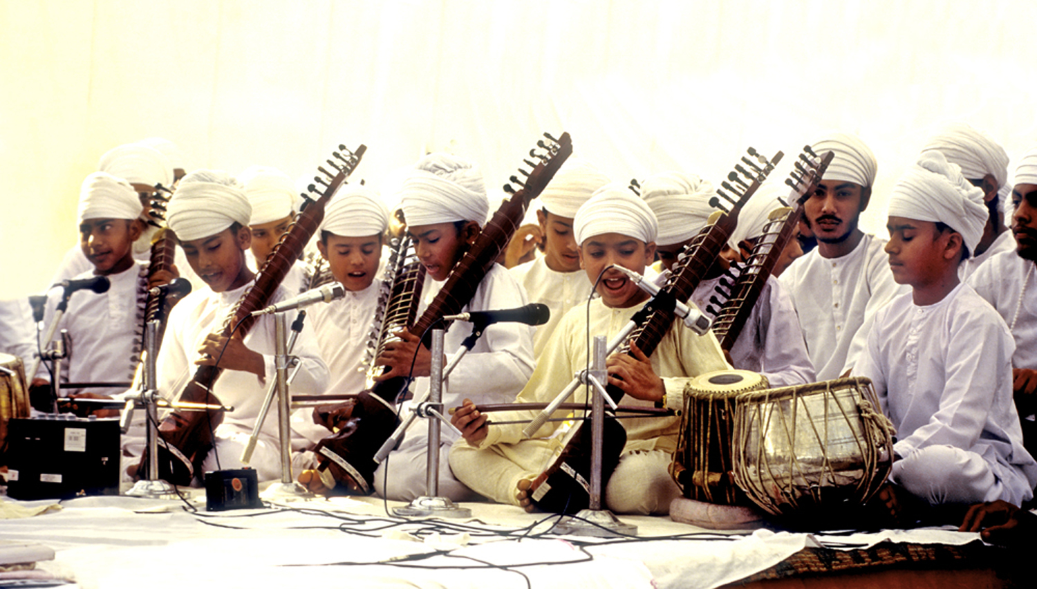 Children performing on stage, most of them play the dilruba. Image credit: V Dikshit Children performing on stage, most of them play the dilruba. Image credit: V Dikshit