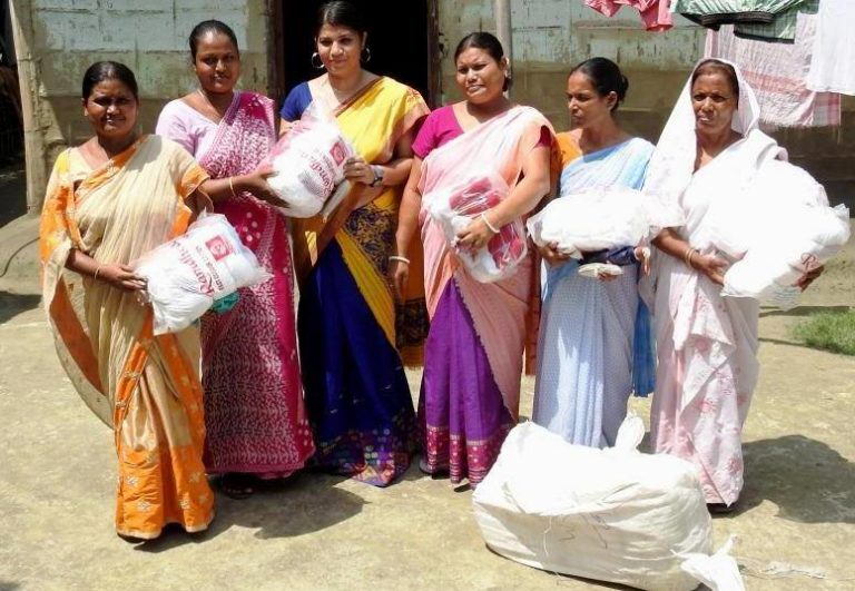 Village women receiving weaving material donated by the Indian government. Image Credit: Aaranyak Village women receiving weaving material donated by the Indian government. Image Credit: Aaranyak