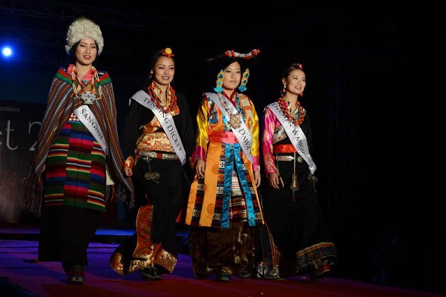 The four finalists in chuba, the traditional Tibetan attire. The four finalists in chuba, the traditional Tibetan attire.