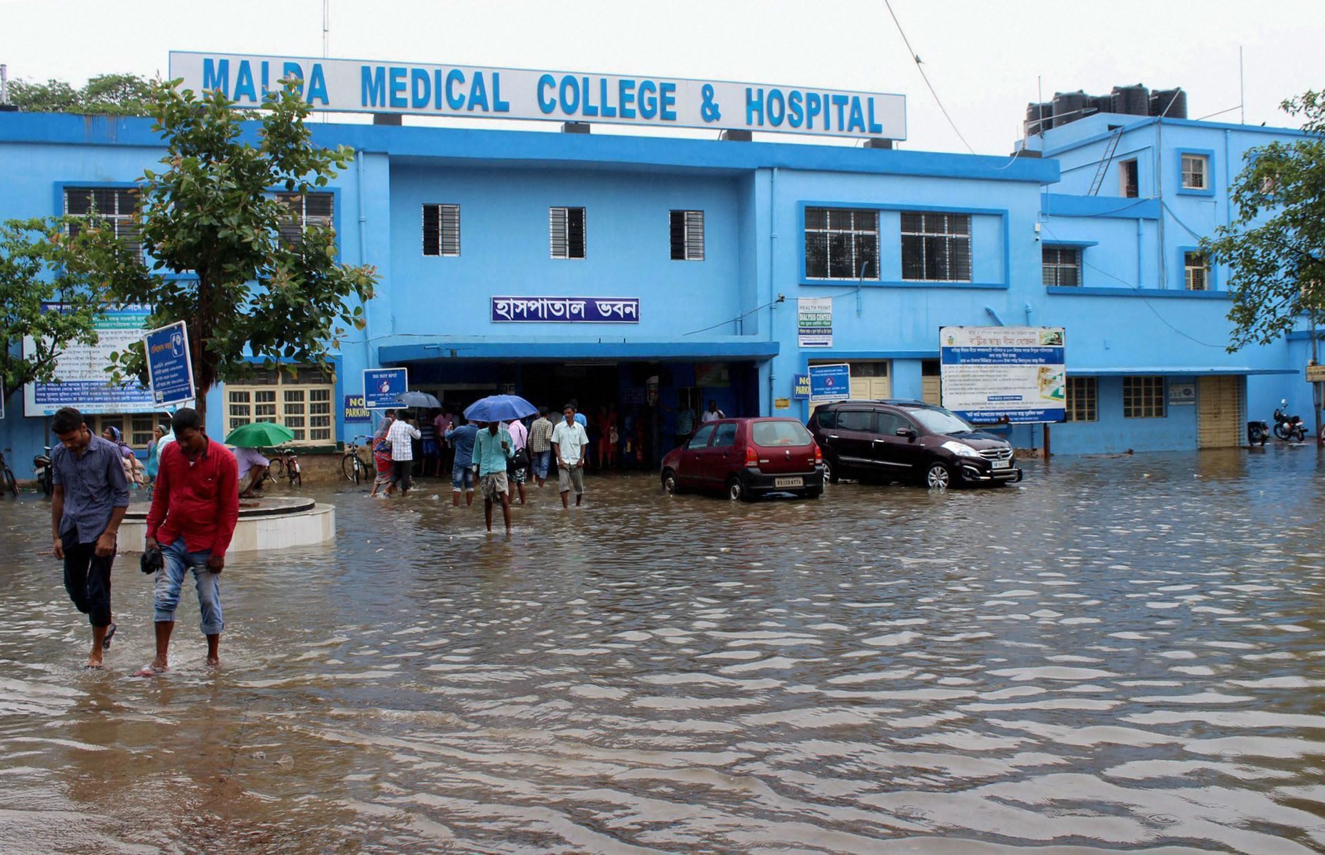 Flood waters outside Malda Medical College and Hospital. PTI Photo Flood waters outside Malda Medical College and Hospital. PTI Photo