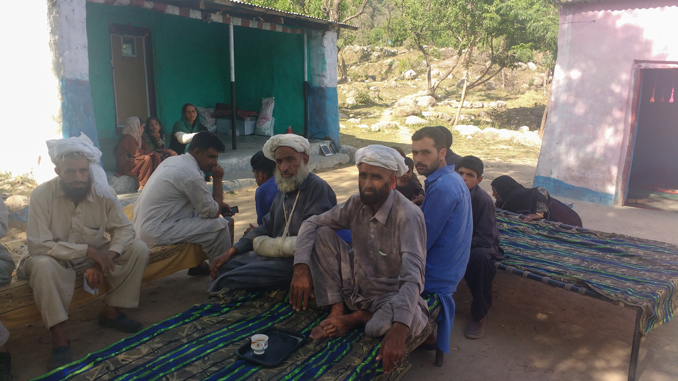 Sabir Ali along with his brohters. Naseem Begum is seen sitting on the porch behind. Sabir Ali along with his brohters. Naseem Begum is seen sitting on the porch behind.
