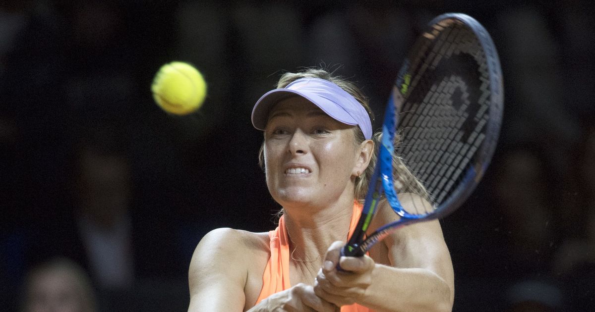 Bouchard beats Sharapova at Madrid Open