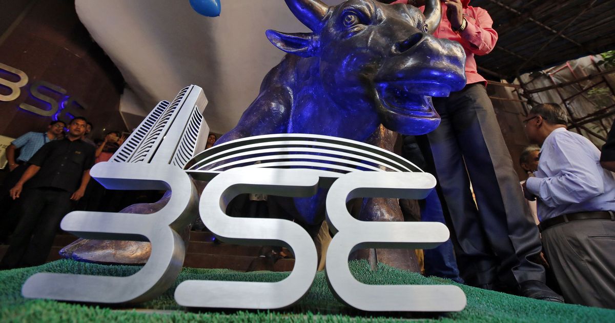 Sensex hits record high, then drops 250 points to close at 30,464.92