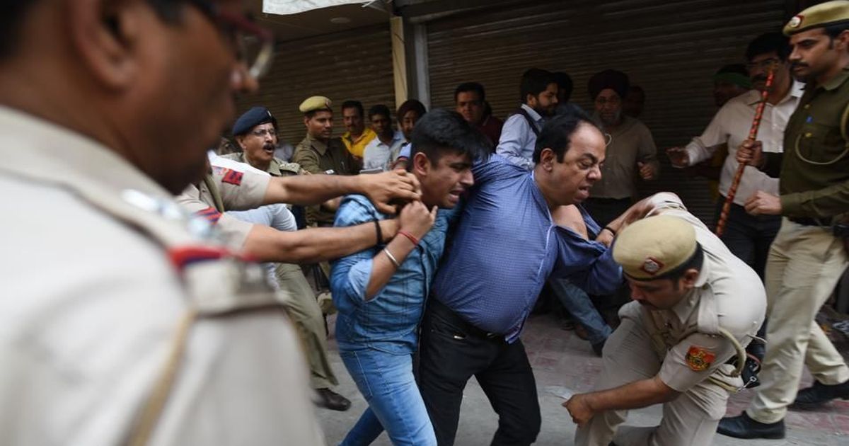 Delhi sealing drive: Photojournalist accuses police of manhandling him