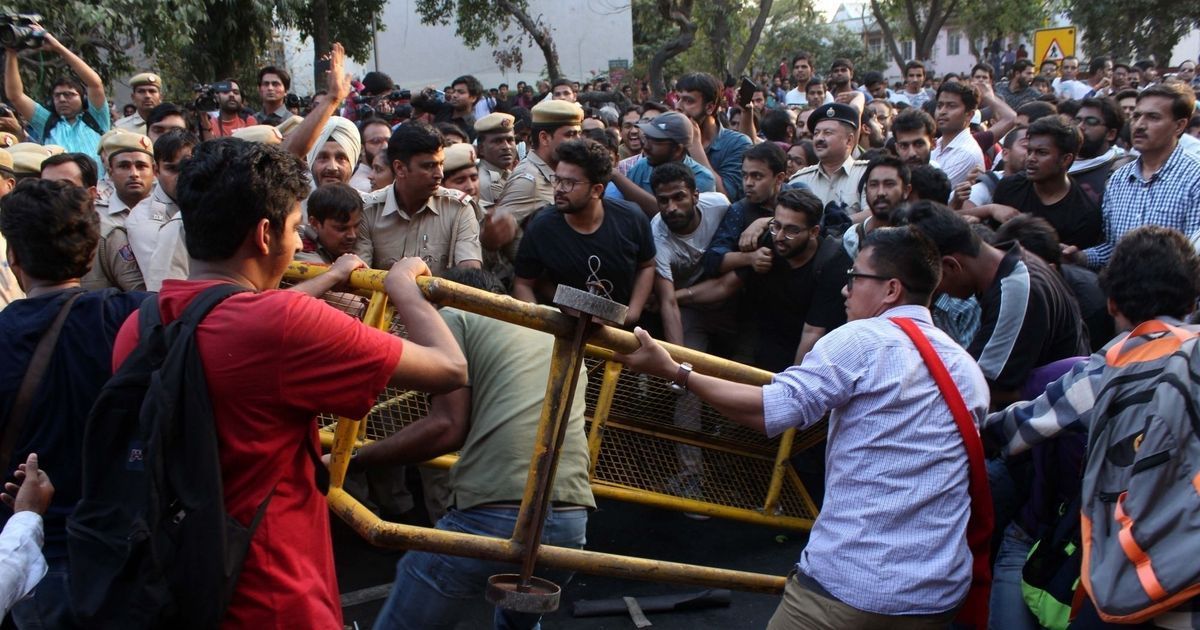 Delhi Police accused of assaulting journalists during JNU protest march