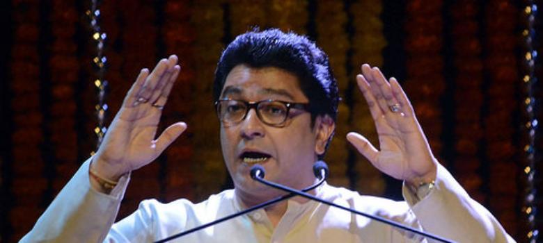 MNS workers cut a cake with Asaduddin Owaisi's image on it to mark Raj Thackeray's birthday