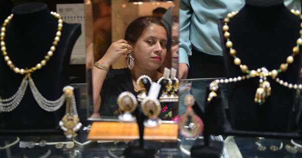 In a new book, personal finance experts advise how to invest in gold, and its pros and cons