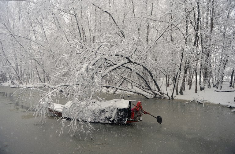 A Kashmiri woman rows her boat during heavy snowfall on Dal Lake in Srinagar on January 6. Credit: Tauseef Mustafa/AFP A Kashmiri woman rows her boat during heavy snowfall on Dal Lake in Srinagar on January 6. Credit: Tauseef Mustafa/AFP