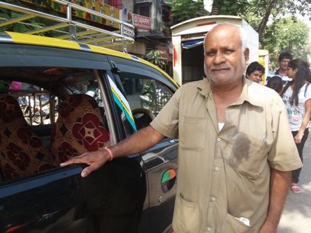 Ambeshah Sharma with his taxi. Ambeshah Sharma with his taxi.