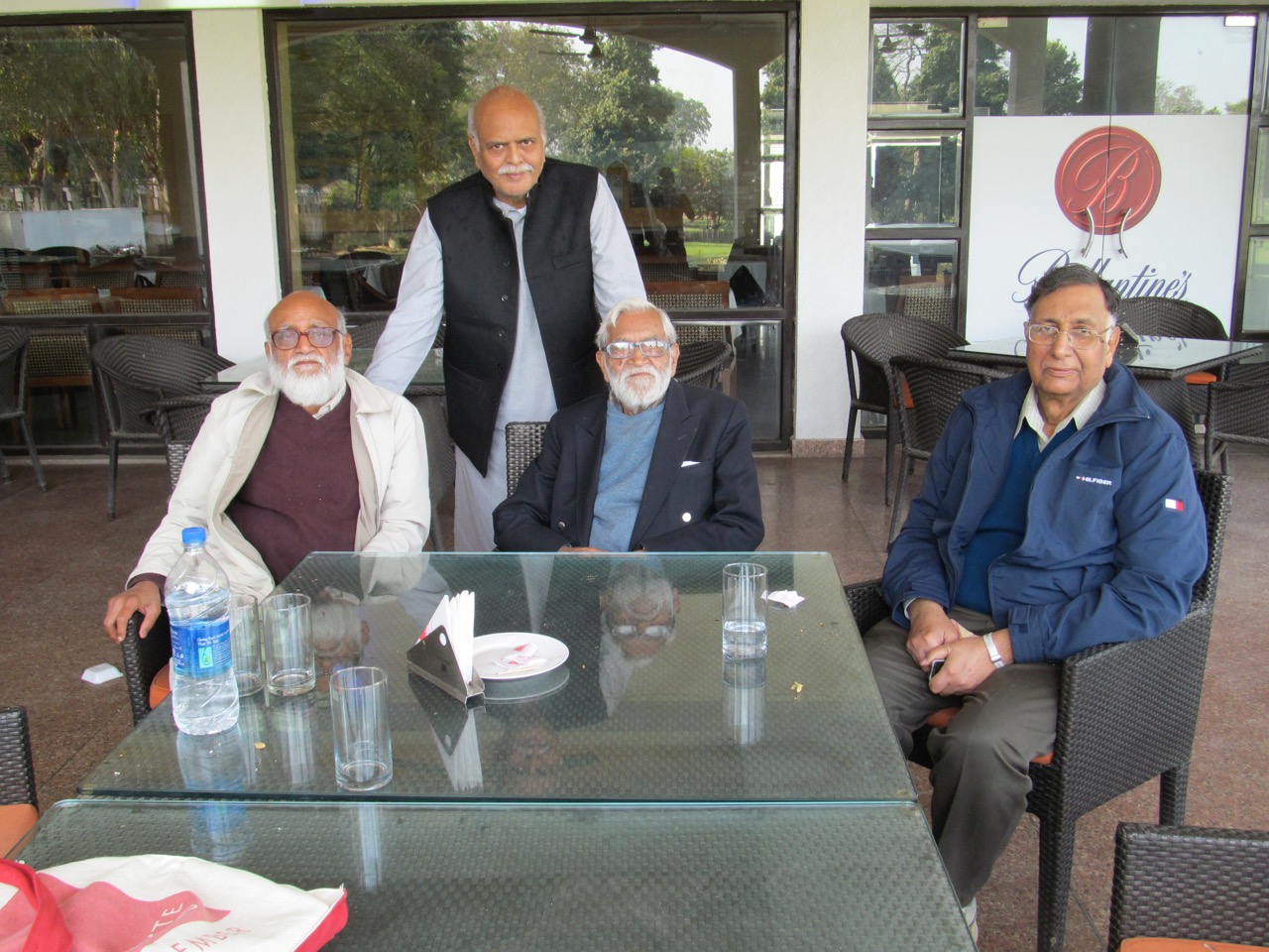 From left, CM Naim, historian Saleem Kidwai (standing), Ram Advani and book collector Aslam Mahmud. Photo: Unknown waiter at Lucknow golf course, February 2015, via CM Naim.