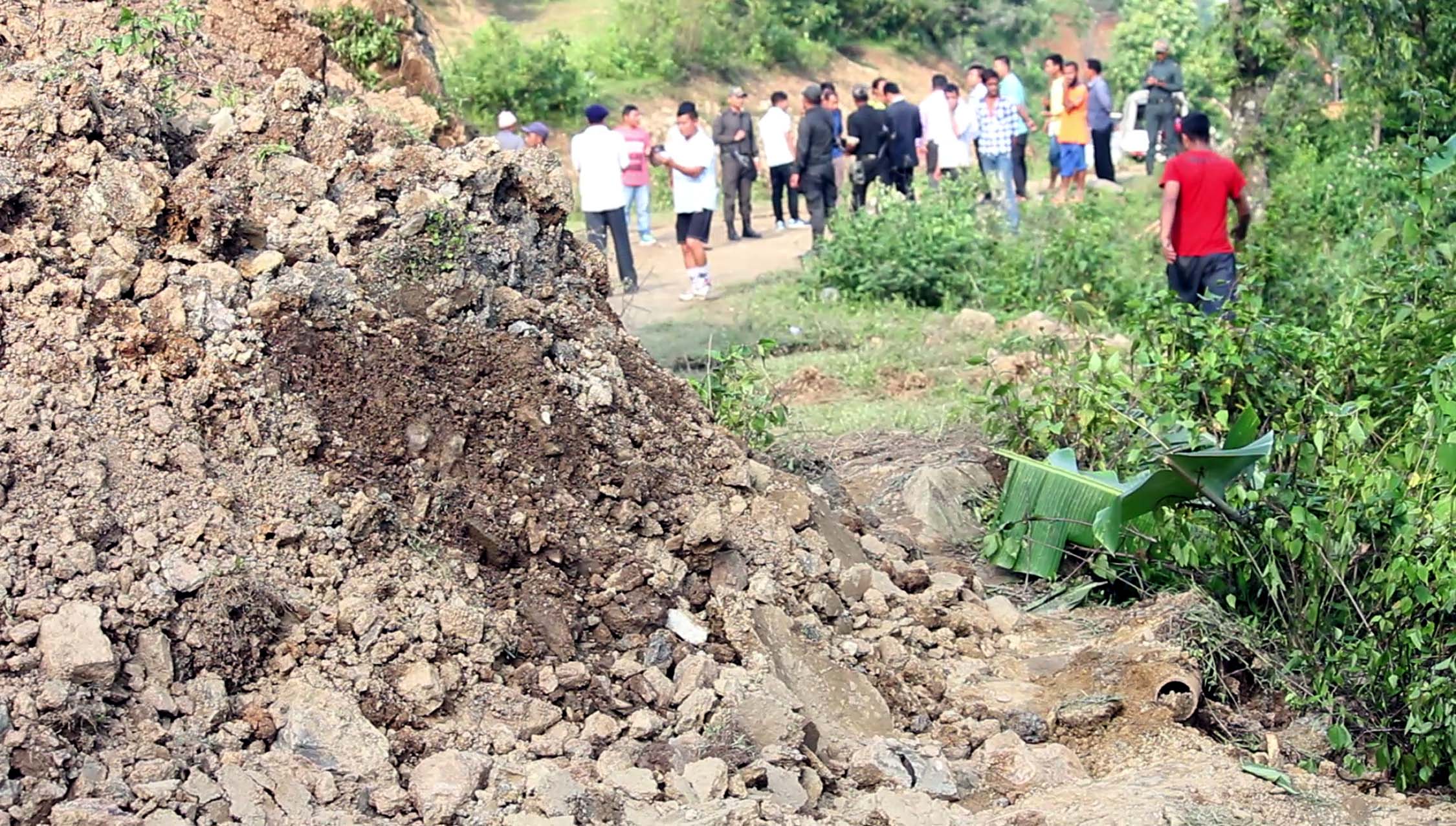 Chunks of earth dislodged by the fissure descend on the Pradhan Mantri Gram Sadak Yojana Road in Kangpokpi district.